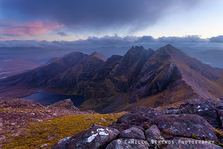 This is just another take of the classic view over the impressive ridge of Sgurr Fiona and An Teallach. Unfortunately the cloud cover prevented an explosion of colours at sunset, but visibility remained decent, so no complaining from me. I would have loved to get lower to emphasize the sandstone rocks a little more, but this would have concealed Loch Toll an Lochain.