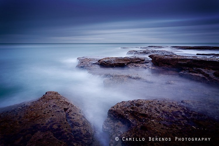 Blue hour before sunrise at a beach near Dunbar, on the East Lothian coast. The long exposure has given the sea this silky appearance, hiding that the waves were actually quite impressive.