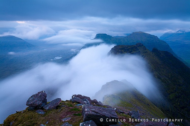 The traverse over the Horns of Beinn Alligin offers fantastic scrambling opportunities while providing jawdropping views. Here the ridge of the Horns is partly obscured by fast moving low hanging clouds at dusk.