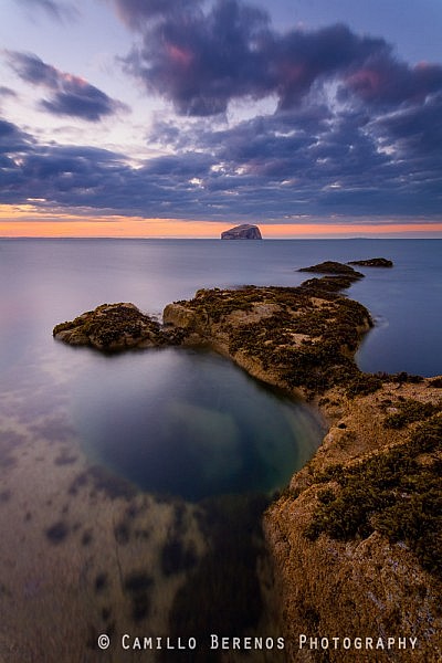 I have a photograph of this rock pool at much lower tide and much choppier conditions I quite like. On this occasion the sea was surprisingly still. The sun had just set, and the golden light was transforming into the beautiful blue hour. Two fishermen were angling just outside this frame, what a view they must have had over the Bass Rock.